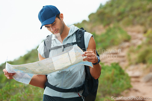 Image of Man, hiking and map for guidance, nature and direction on trail, fitness and exercise on holiday. Male person, lost and documents for information, travel and journey or adventure to forest for cardio