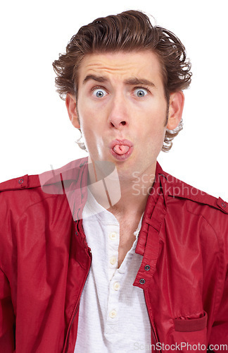 Image of Silly, tongue out and portrait of a man with funny joke and comedy face gesture in a studio. Modern, quirky and hipster fashion of a male model with fun and playful in a white background with outfit