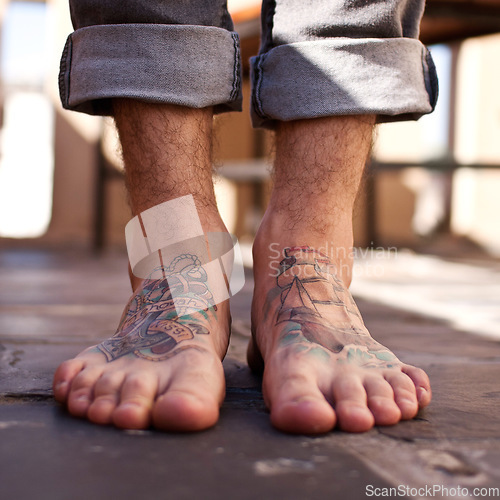 Image of Person, feet and tattoo design for creative artist or illustration on skin for unique personality, edgy or cool. Toes, foot and drawing for trendy rocker ink as alternative metal, identity or culture