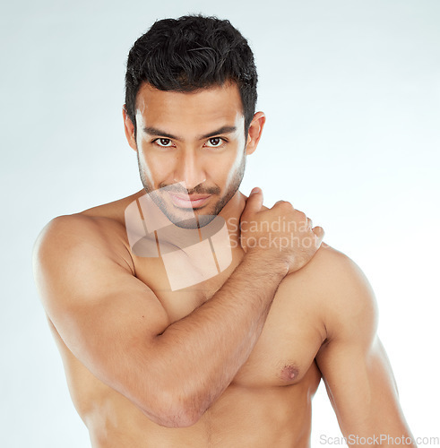 Image of Skincare, body and portrait of asian man in studio for wellness, cosmetics or treatment on white background. Beauty, face and muscular model with hand on shoulder for smooth skin dermatology results