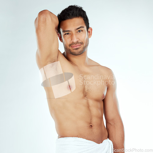 Image of Shower, towel and portrait of fitness man in studio for cleaning, wellness or cosmetics on white background. Bathroom, body and face of Japanese model with smooth skin, satisfaction or luxury pamper