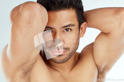 Image of Skincare, body and portrait of fitness man in studio for wellness, cosmetics or treatment on white background. Beauty, face and muscular model with bicep, flex and smooth skin dermatology results