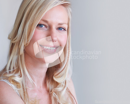 Image of Portrait, beauty and smile of woman in hair care at studio isolated on a white background mockup space. Face, happy blonde model and hairstyle in salon treatment, healthy cosmetics and natural skin