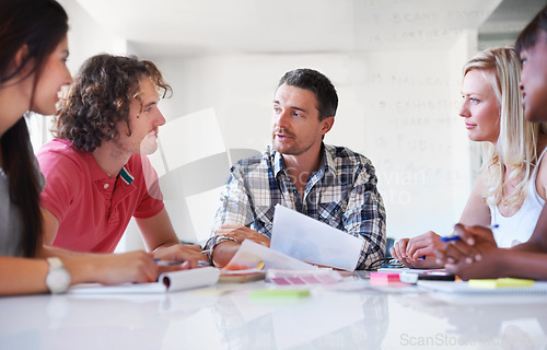 Image of Group, creative and business people brainstorming at table in meeting, cooperation and collaboration in office startup. Teamwork, designer and color swatches, planning strategy together or discussion