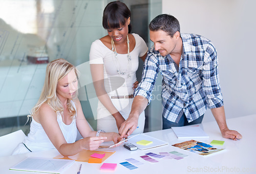 Image of Teamwork, creative and business people planning at table in meeting, decision or collaboration in office startup. Happy group, designer and color swatches on picture or brainstorming palette together