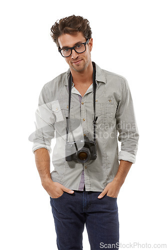 Image of Portrait, confident man and photographer with camera on neck in studio isolated on a white background in Spain. Person in glasses, creative paparazzi and fashion style of model with hands in pocket