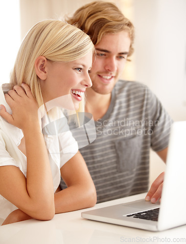 Image of Laptop, smile and investment with a young couple in their apartment for accounting or budget planning together. Computer, bank or saving with a happy man and woman in their home for loan or growth