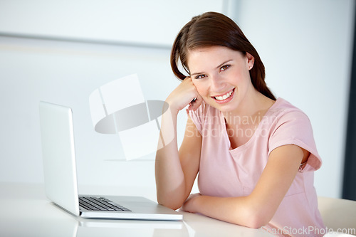 Image of Business woman, portrait and smile at laptop in office at desk for online research, website review and planning connection in creative startup. Happy designer working at computer in digital agency