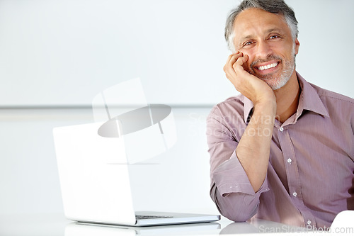 Image of Mature man, portrait and smile laptop in office to review online research, website connection and project management at desk. Happy entrepreneur, business manager and working on computer with pride