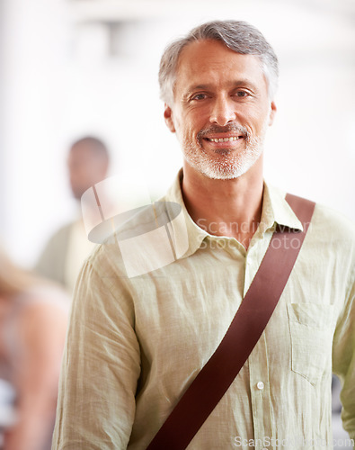 Image of Mature, director and portrait of business man in startup agency for creative, manager and designer. Professional, consultant and advisor with face of employee in office for entrepreneur career