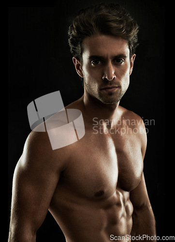 Image of Topless, black background or portrait of man for bodybuilding results, six pack or stomach in studio. Fitness model, dark or ripped person with healthy body, abs or muscle for wellness in Italy