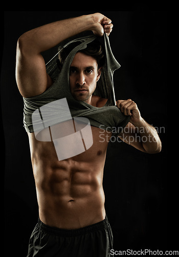 Image of Portrait, black background or man undress with six pack, strong abs or stomach in studio for fitness. Off, cool model or ripped person with healthy body, dark shadow or abdomen muscle for wellness