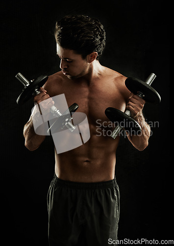 Image of Dumbbells, black background or topless bodybuilder in exercise, strength training or workout in studio. Fitness model, dark or ripped man with healthy body, weights or biceps muscle for lifting power