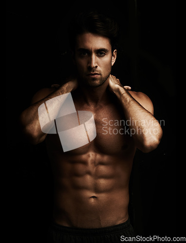 Image of Six pack, black background or portrait of model for workout, training or exercise in studio for fitness. Man, dark or ripped male person with healthy body, abs or stomach for wellness in Italy