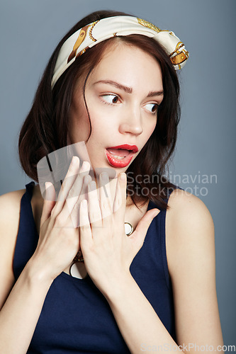 Image of Wow, shock and woman with hands on face in studio for surprise, news or fashion sale announcement on grey background. Omg, gossip and female model with oops emoji for drama, secret or giveaway promo
