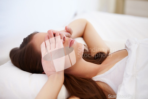 Image of Wake up, fatigue and tired woman in bed with hands on eyes frustrated with insomnia, crisis or disaster. Bedroom, problem or female person in house with sleeping issue, struggle or low energy at home