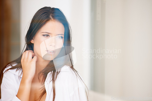 Image of Woman, thinking and confident in studio with fashion, edgy style and trendy outfit for aesthetic or shirt. Person, face and pride with thoughtful, contemplating or mock up space on white background