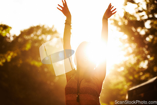 Image of Woman, sunset and outdoor festival for party, event or holiday weekend with arms up in nature freedom. Excited casual female person in celebration for music, concert or sunrise in forest outside