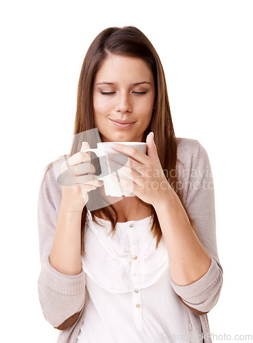 Image of Coffee, relax and morning with a young woman in studio isolated on a white background for caffeine. Happy, calm and quiet with a confident person drinking tea from a mug or cup to start her day