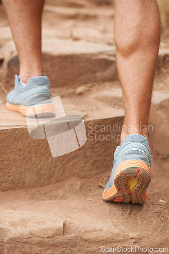 Image of Closeup, legs and person hiking steps in nature for fitness, workout and exercise training for wellness, health or sports. Zoom, feet or hiker muscles walking or climbing stairs in environment cardio