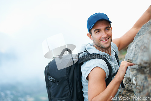 Image of Fitness, portrait and rock with man and climbing in nature for adventure, health and performance. Training, environment and explore with person on cliff of mountain terrain for backpacking and travel