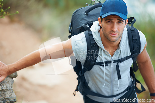 Image of Portrait, hiking and man with nature, adventure or exercise with wellness, progress or challenge with workout. Person, hiker or guy with backpack, hobby or activity with training, travel or endurance