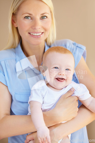 Image of Portrait, smile or home mother, baby or family happiness for newborn child growth, mom youth care or maternity. Happy face, smile and mama holding, hug or embrace toddler for bonding, nurture or love