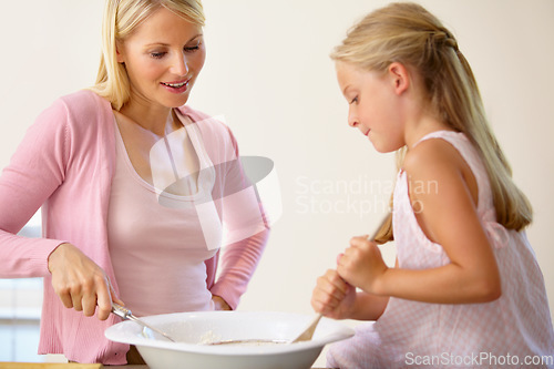 Image of Bowl, stir and baking mom, child or family mix batch, food or prepare recipe, wheat flour or ingredients. Kitchen equipment, teaching and kid learning home cooking together for Mothers Day bonding