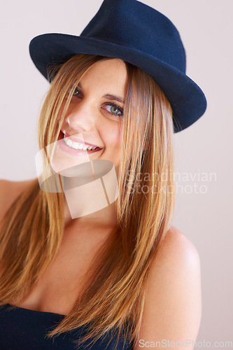 Image of Hipster, hat and portrait of happy woman with vintage, fashion and confidence in white background or studio. Retro, style and face of person in old fashioned fedora with makeup, cosmetics and beauty