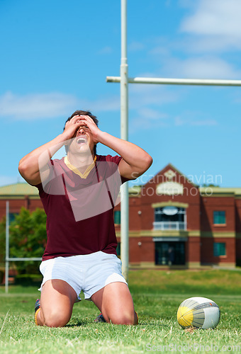 Image of Upset, sad and rugby player on a field for competition loss for training and match. Fit, athlete and sports with man and ball for mistake or fail in competitive looking frustrated in a uniform