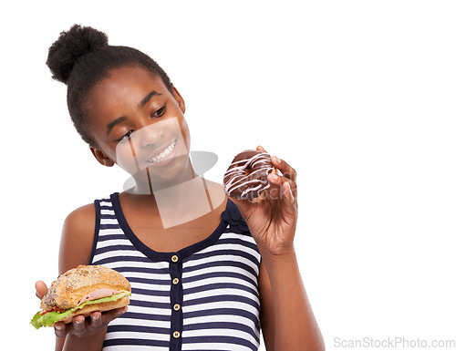 Image of Black girl, decision and donut with sandwich, smile and nutrition isolated on a white studio background. African person, mockup space and model with sweet snack, choice and comparison with wellness