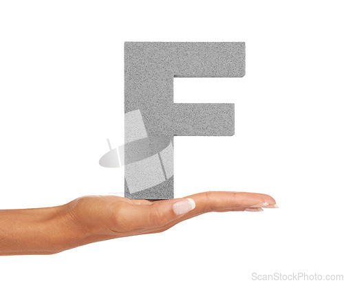 Image of Hands, person and capital letter F in studio for alphabet, fonts or learning english language on white background. Closeup, text design and typography character for grammar sign, teaching or spelling