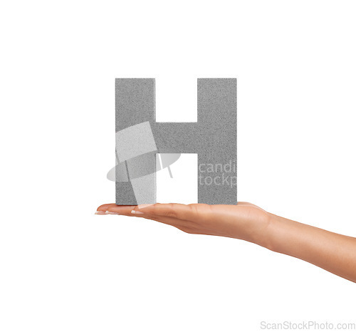 Image of Hand of woman, capital letter H and presentation of consonant isolated on white background. Character, font and palm showing English alphabet typeface for communication, reading and writing in studio