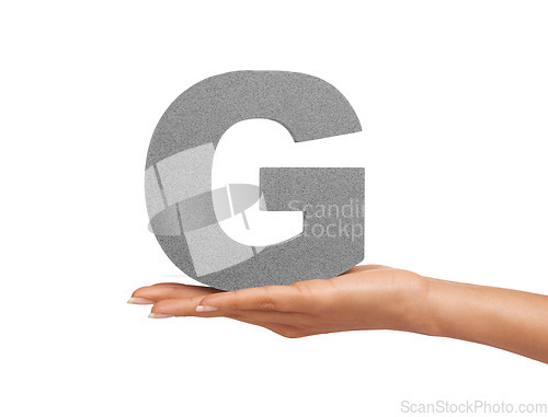 Image of Hand, capital letter G and presentation of font consonant isolated on white background. Character, palm and woman showing English alphabet typeface for communication, reading and writing in studio.