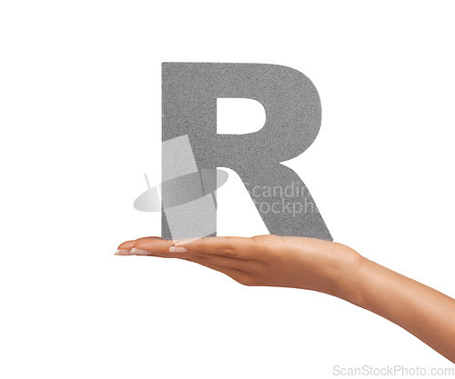 Image of Woman, hand and letter or alphabet in studio for advertising, learning or teaching presentation. Sign, font or character for marketing, text or communication and grammar or symbol on white background