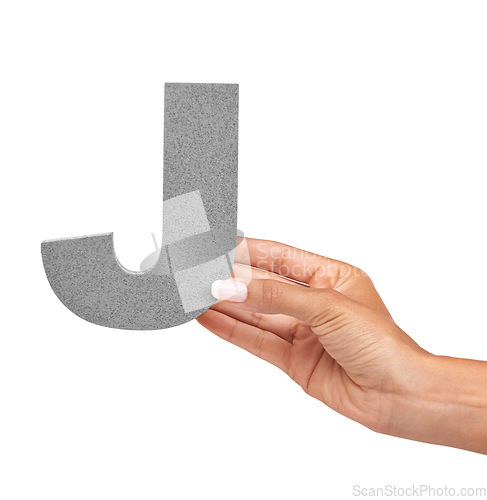 Image of Hand of woman, capital letter J and presentation of consonant isolated on white background. Character, font and palm with English alphabet typeface for communication, reading and writing in studio.