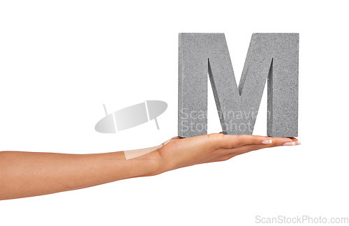 Image of Woman, hand and letter M or font in studio for advertising, learning or teaching on mock up. Sign, alphabet or character for reading, text or communication and grammar or symbol on white background