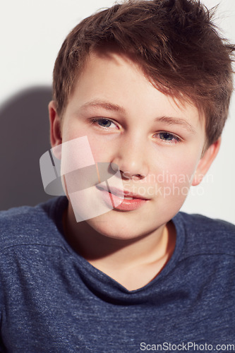 Image of Teenager, thinking and face of boy in studio, white background or dream of future with vision. Kid, relax and wonder with inspiration or confident child with a smile and insight in mock up space