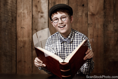 Image of Learning portrait, book or young happy child, learner or pupil reading information, literature story or studying. Knowledge textbook, happiness or kid student education, literacy or research homework