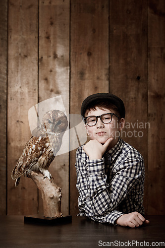 Image of Young child, portrait and confident with thinking by owl, pride and vintage fashion with glasses in mockup. Boy, face and nerd with wise bird in retro clothes with eyewear, contemplation and smart