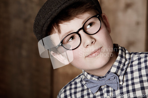 Image of Face, ideas and young child thinking of learning development, education or problem solving solution. Fashion glasses, sophisticated style and kid question why for nerd choice, memory or brainstorming