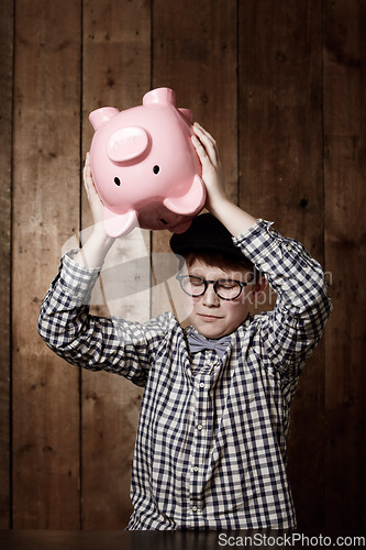 Image of Piggy bank, smash and sad boy child with investment, growth or savings fail at home. Economy, inflation and unhappy kid with money, box or cash container for emergency payment, loan or empty account