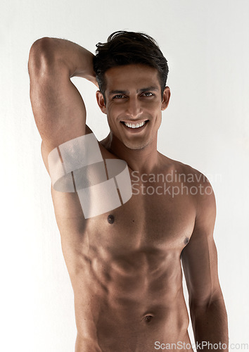 Image of Muscle, portrait and smile with man, abs and fitness isolated on a white studio background with wellness. Face, person and model with happiness, six pack or bodybuilder with joy, cheerful and healthy