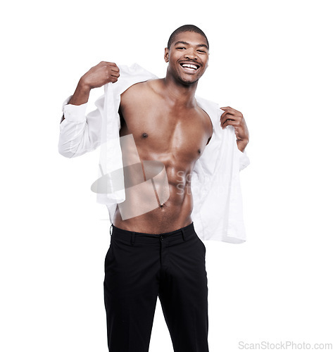 Image of Man, fashion and portrait with abs, shirt and dressing for work, african and male model in white background. Alone, smile and happy with six pack, body and corporate wear, stylish and masculine