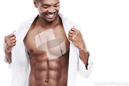 Image of Man, fashion and muscle with abs, shirt and dressing for chest, african and male model in white background. Alone, smile and happy with six pack, body and corporate wear, stylish and masculine