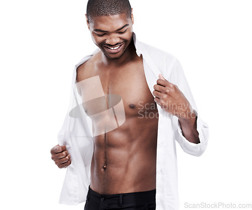 Image of Man, fashion and muscle with abs, sexy and dressing for chest, african and male model in white background. Alone, smile and happy with six pack, shirt and corporate wear, stylish and masculine