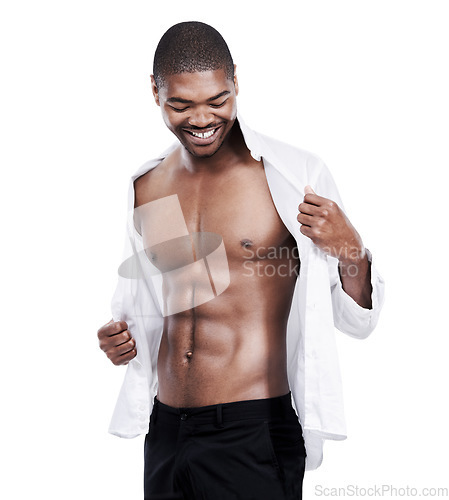 Image of Man, fashion and muscle with abs, shirt and dressing for chest, african and male model in white background. Alone, smile and happy with six pack, body and corporate wear, stylish and masculine