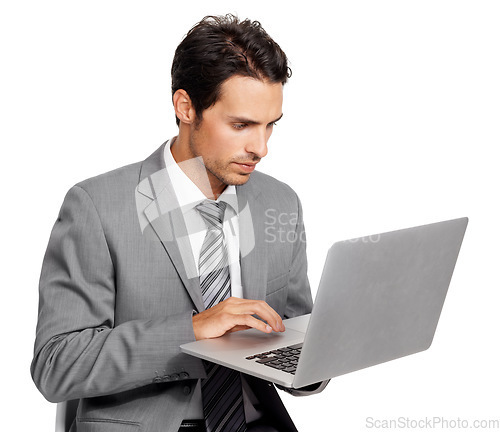 Image of Business man, laptop and typing in studio for online report, stock market information or review update of digital trading on white background. Serious corporate trader, broker or research on computer