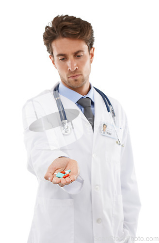 Image of Doctor, man and prescription of pills in studio, wellness medication and healthcare in pharmaceuticals. Pharmacist, face and serious in medicine support, advice tablets and drugs by white background
