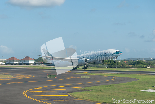 Image of Cathay Pacific Boeing 777 taking off in Bali